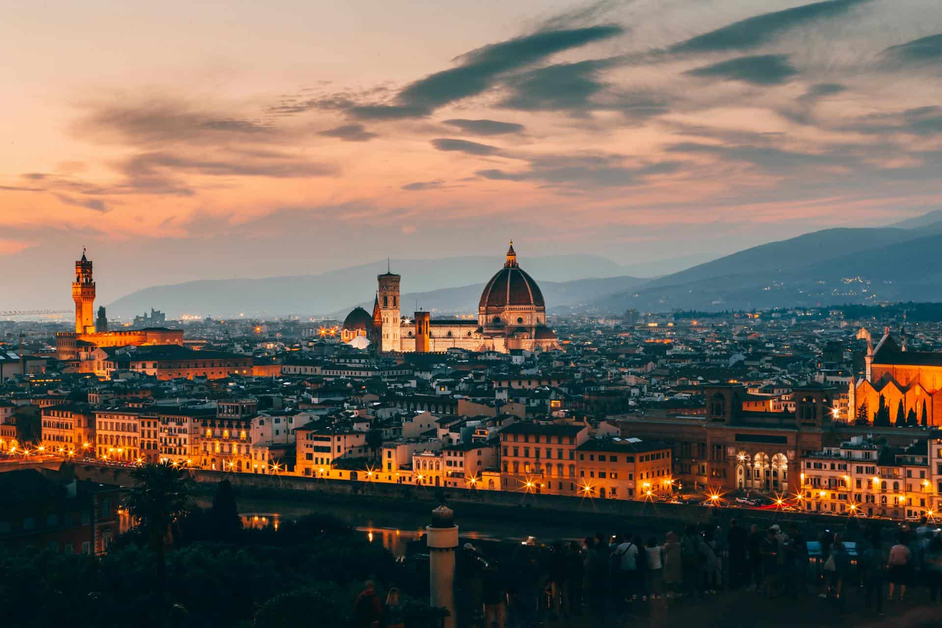 anniversaries-img-02 Breathtaking sunset view of Florence, Italy featuring the iconic Florence Cathedral and Ponte Vecchio, showcasing a picturesque romantic travel destination in Tuscany.