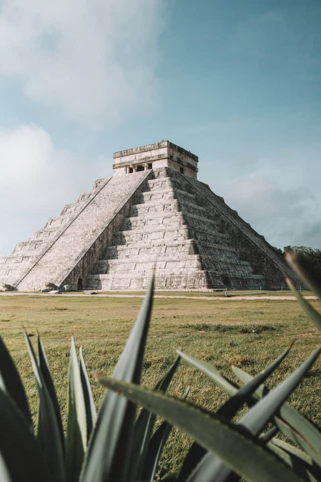 Ancient Mayan pyramid at Chichen Itza, a top destination for historical and cultural travel experiences in Mexico.