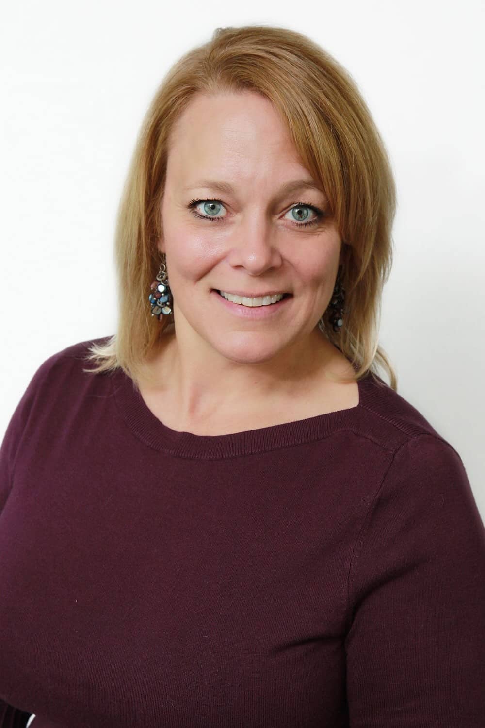 Kathy-Headshot Sunset family travel on coastal cliff, enjoying scenic ocean views, exploring nature, outdoor adventure, and vacation memories at the beach.